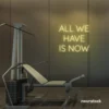 All We Have Is Now neon sign in warm white for modern wall decor, dorms, and cozy interiors.