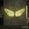 Elegant angel wings neon sign in warm white for wall art or restaurant decor.
