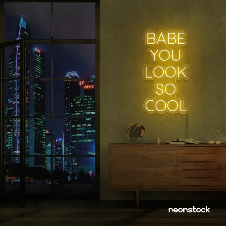 Babe You Look So Cool neon sign in golden yellow for glam rooms, salons, and modern home decor.
