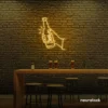 Beer bottle neon sign in golden yellow for bar or man cave wall decor.