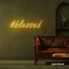 Blessed neon sign in golden yellow for spiritual decor, homes, and motivational spaces.