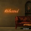 Blessed neon sign in peachy pink for spiritual decor, homes, and motivational spaces.