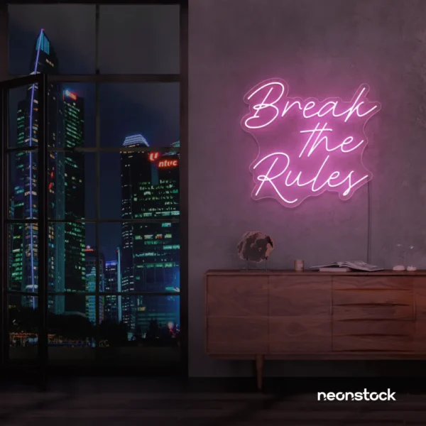 Break the Rules neon sign in baby pink for rebellious decor, creative studios, and bold interiors.