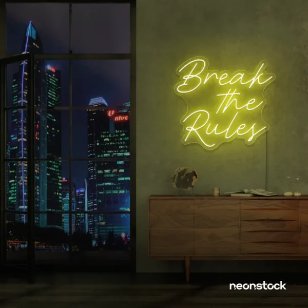 Break the Rules neon sign in lemon yellow for rebellious decor, creative studios, and bold interiors.