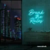 Break the Rules neon sign in mint green for rebellious decor, creative studios, and bold interiors.