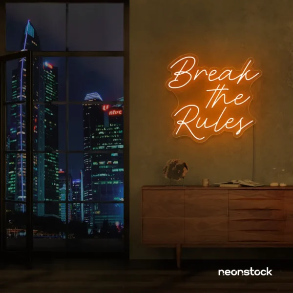 Break the Rules neon sign in orange for rebellious decor, creative studios, and bold interiors.