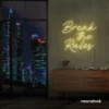 Break the Rules neon sign in warm white for rebellious decor, creative studios, and bold interiors.