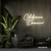 California Dreamin' neon sign in neutral white for beachy decor, cozy interiors, and travel-inspired rooms.