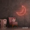 Moon neon sign in peachy pink for kids' rooms, nurseries, and celestial-themed home decor.