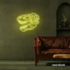 Dinosaur skull neon sign in lemon yellow for prehistoric wall art and edgy decor.