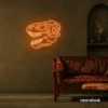 Dinosaur skull neon sign in orange for prehistoric wall art and edgy decor.