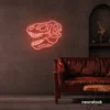 Dinosaur skull neon sign in peachy pink for prehistoric wall art and edgy decor.