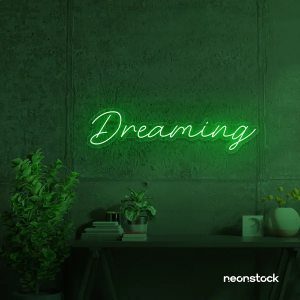 Dreaming neon sign in deep green for dreamy decor, teen bedrooms, and relaxing nooks.