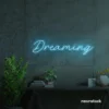 Dreaming neon sign in ice blue for dreamy decor, teen bedrooms, and relaxing nooks.