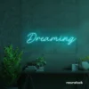 Dreaming neon sign in mint green for dreamy decor, teen bedrooms, and relaxing nooks.