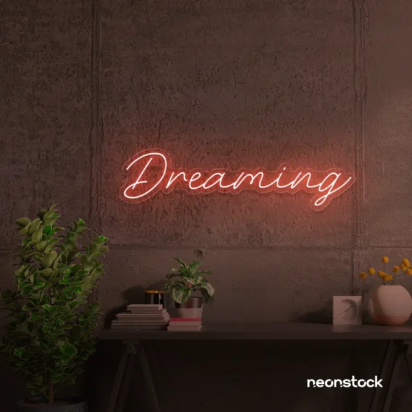 Dreaming neon sign in peachy pink for dreamy decor, teen bedrooms, and relaxing nooks.