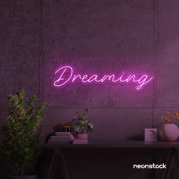 Dreaming neon sign in pink for dreamy decor, teen bedrooms, and relaxing nooks.