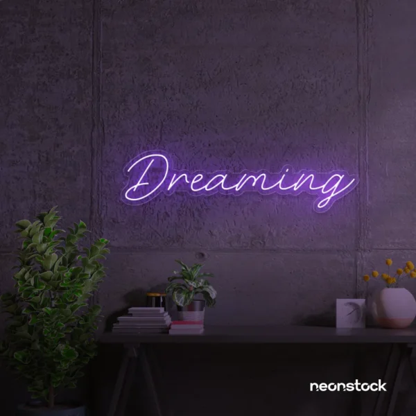 Dreaming neon sign in purple for dreamy decor, teen bedrooms, and relaxing nooks.