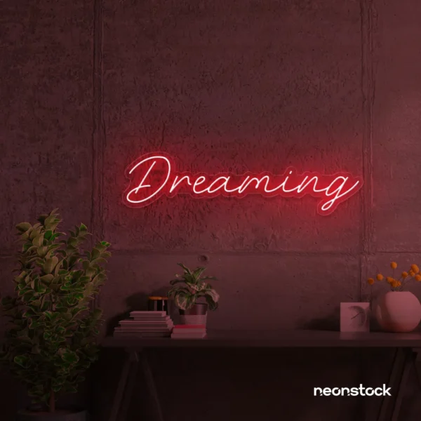 Dreaming neon sign in red for dreamy decor, teen bedrooms, and relaxing nooks.