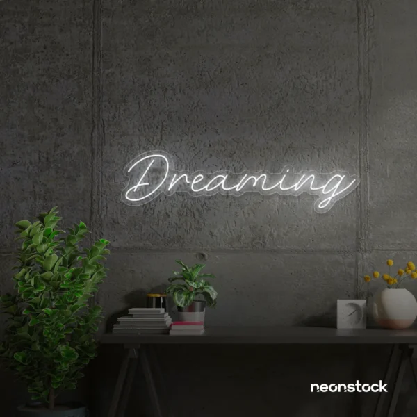 Dreaming neon sign in white for dreamy decor, teen bedrooms, and relaxing nooks.