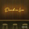 Drunk In Love neon sign in golden yellow for wedding decor, engagement parties, romantic celebrations
