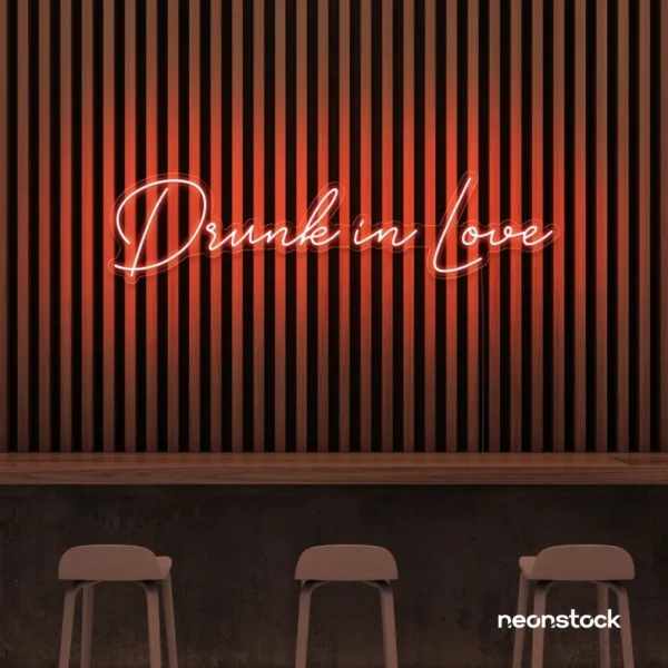 Drunk In Love neon sign in peachy pink for wedding decor, engagement parties, romantic celebrations
