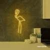 Flamingo neon sign in golden yellow for kids room or tropical-themed decor