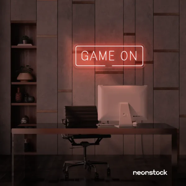 Game On neon sign in peachy pink for gaming setups, man caves, and kids' rooms.