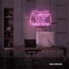 Gaming controller neon sign in baby pink for game rooms, stream setups, and kids' walls.