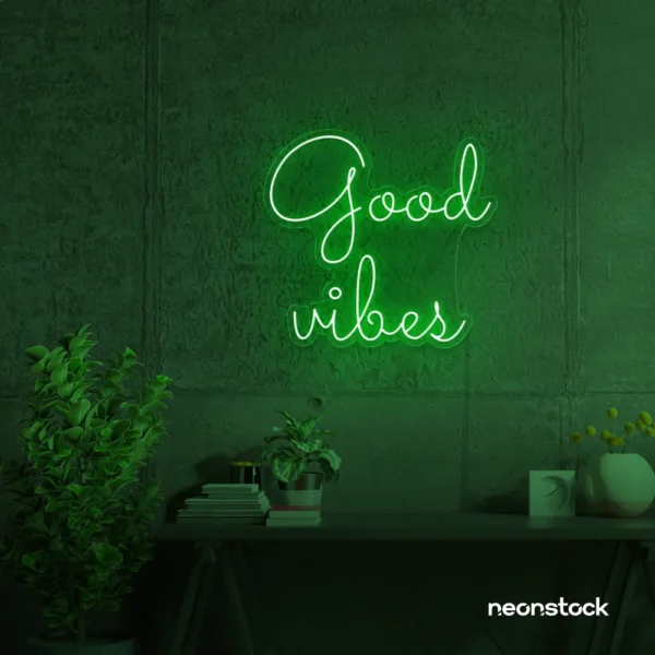 Good Vibes neon sign in deep green for positive room decor, dorm walls, and relaxing interiors.