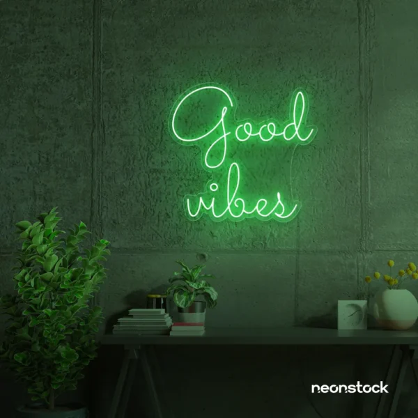 Good Vibes neon sign in green for positive room decor, dorm walls, and relaxing interiors.