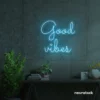 Good Vibes neon sign in ice blue for positive room decor, dorm walls, and relaxing interiors.