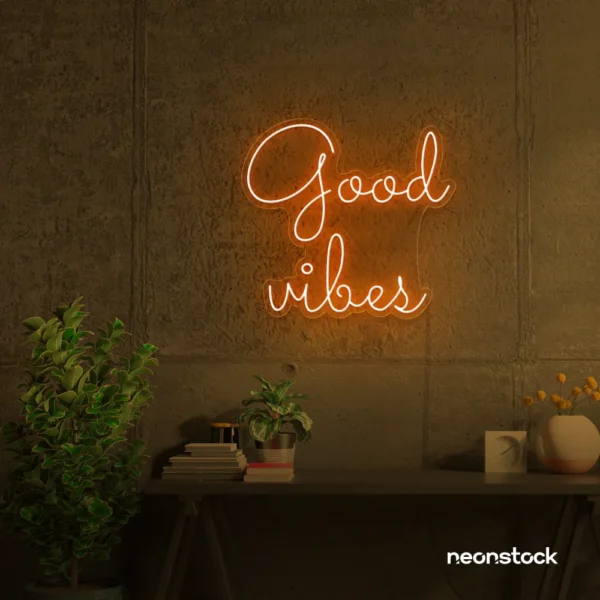 Good Vibes neon sign in orange for positive room decor, dorm walls, and relaxing interiors.