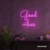 Good Vibes neon sign in pink for positive room decor, dorm walls, and relaxing interiors.