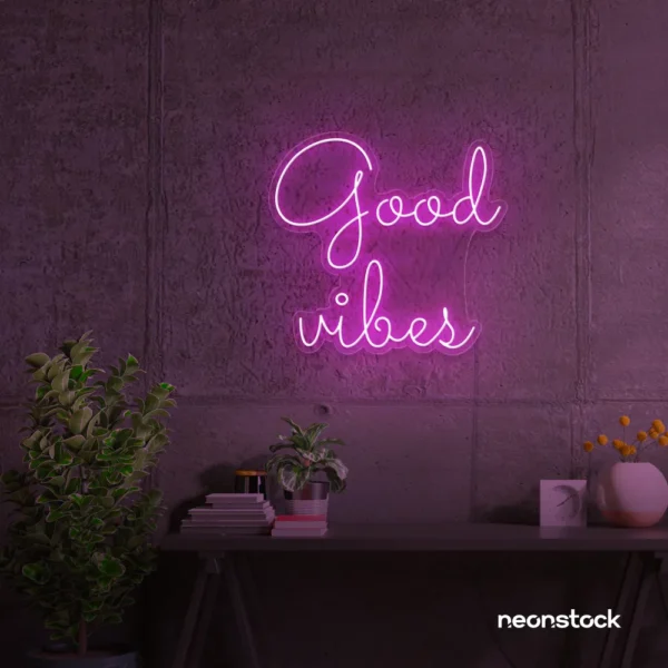 Good Vibes neon sign in pink for positive room decor, dorm walls, and relaxing interiors.