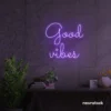 Good Vibes neon sign in purple for positive room decor, dorm walls, and relaxing interiors.