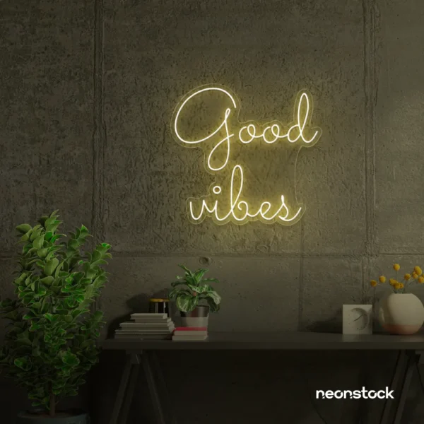 Good Vibes neon sign in warm white for positive room decor, dorm walls, and relaxing interiors.