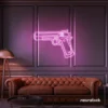 Gun neon sign in baby pink – edgy LED wall decor for modern spaces and game rooms.