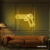 Gun neon sign in golden yellow – edgy LED wall decor for modern spaces and game rooms.