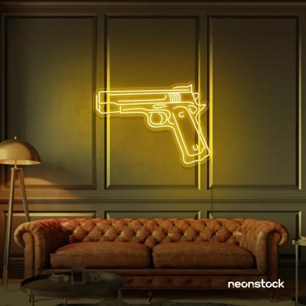 Gun neon sign in golden yellow – edgy LED wall decor for modern spaces and game rooms.