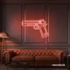 Gun neon sign in peachy pink – edgy LED wall decor for modern spaces and game rooms.