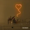 Heart balloon neon sign in orange for kids' rooms, Valentine's Day decor, and romantic wall styling.