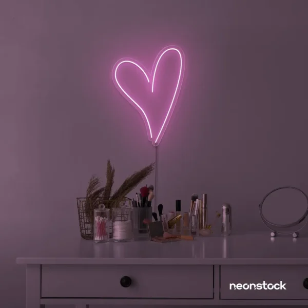 Heart neon sign in baby pink for beauty salons, home decor, dorm rooms, and Valentine's Day themes.