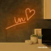 'In Love' neon sign in orange for wedding and Valentine's Day decor