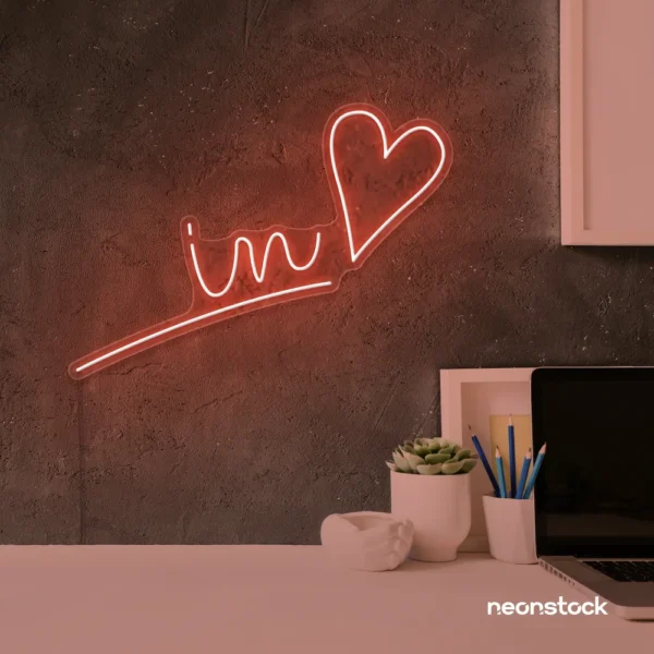 'In Love' neon sign in peachy pink for wedding and Valentine's Day decor