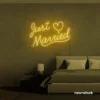Just Married neon sign in golden yellow for wedding decor, bridal shower, reception backdrop