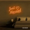 Just Married neon sign in orange for wedding decor, bridal shower, reception backdrop