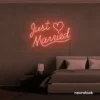 Just Married neon sign in peachy pink for wedding decor, bridal shower, reception backdrop