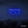 Keep Being You neon sign in dark blue for empowerment decor, teen rooms, and creative wall spaces.