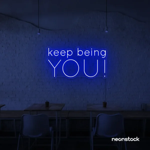 Keep Being You neon sign in dark blue for empowerment decor, teen rooms, and creative wall spaces.